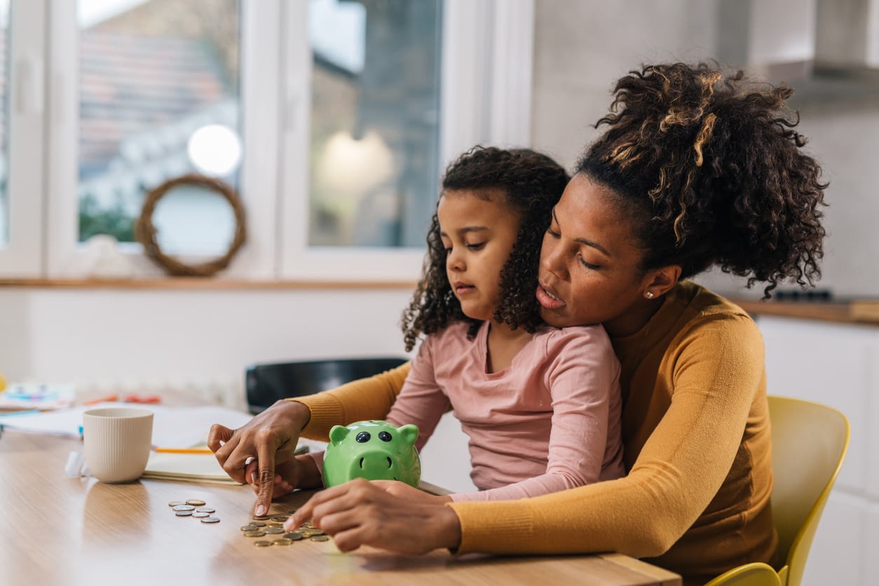 multiracial woman and daughter at home